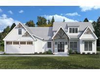 Charming white farmhouse with contrasting wood trim, a metal roof, a two-car garage and a well-manicured lawn at 571 Bearden, Douglasville, GA 30134
