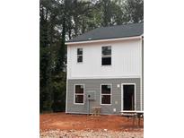 New construction two-story home with gray and white siding and black roof at 7238 Crestside Dr, Austell, GA 30168