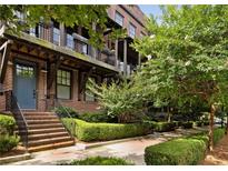 Beautiful brick townhome with an inviting entrance and professionally landscaped front yard at 345 Glen Iris Ne Dr # 5, Atlanta, GA 30312