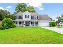 Charming two-story home with a welcoming front porch and well-manicured lawn at 10 Callaway Ct, Hiram, GA 30141