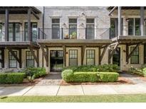Multi-story townhome with brick facade and private balconies at 18 Peachtree Ne Ave # 5, Atlanta, GA 30305
