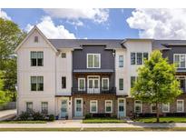 Attractive three-story townhome with Hardie Board siding, brick accents, and a charming second-story balcony at 3484 Orchard St, Atlanta, GA 30354