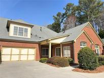 Charming brick home with a two-car garage and well-maintained landscaping at 120 Chastain Nw Rd # 1803, Kennesaw, GA 30144
