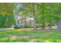 Inviting two-story home with lush landscaping and charming curb appeal at 113 Hitchcock Dr, Villa Rica, GA 30180