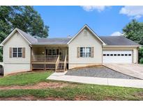 Charming one-story home with a manicured lawn and attached garage, providing comfort and convenience at 350 Dailey Mill Rd, Mcdonough, GA 30253