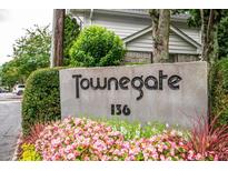 Community sign with colorful flower bed in front of Townegate neighborhood at 136 Peachtree Memorial Nw Dr # Pa4, Atlanta, GA 30309