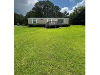 Charming single-story home featuring a small porch and well-maintained lawn at 1631 Billy Bullock Rd, Dallas, GA 30157