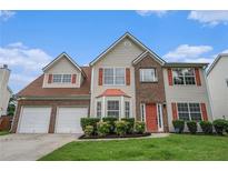 Charming two-story home featuring a two-car garage and a well-manicured lawn and traditional design elements at 555 Sydney Crest Ln, Lawrenceville, GA 30046