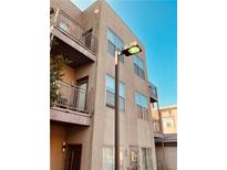 Multi-story condo features balconies, neutral stucco, large windows and a blue sky at 238 Walker Sw St # 22, Atlanta, GA 30313