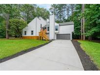 Beautifully renovated two story home with new paint, attached garage and large driveway at 2189 Spear Point Dr, Marietta, GA 30062