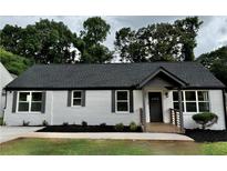 Charming renovated home featuring a gray roof, gray shutters, and a lovely front porch at 1937 Don Juan Ln, Decatur, GA 30032