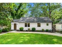 Charming home with a well-manicured lawn and a welcoming exterior at 1556 Braeburn Se Dr, Atlanta, GA 30316