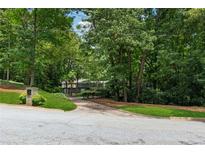 Secluded home with lush greenery offering a private retreat and picturesque landscape at 285 Glen Lake Dr, Atlanta, GA 30327
