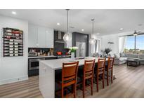 Modern kitchen features a large island with seating and stainless steel appliances at 788 W Marietta Nw St # 308, Atlanta, GA 30318