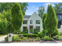 Beautiful two-story home with a well-manicured front yard and charming curb appeal at 1433 Wessyngton Ne Rd, Atlanta, GA 30306