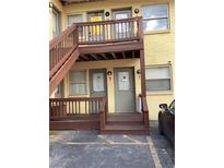 Two-story apartment building features gray doors and brown stairs to the second level at 561 Formwalt Sw St # 7, Atlanta, GA 30312