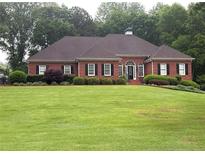 Charming brick home with manicured lawn and black shutters at 753 Summer Ridge Dr, Villa Rica, GA 30180