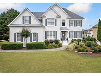 Charming two-story home with landscaped yard and inviting curb appeal in a residential neighborhood at 200 Glen Wood Place, Canton, GA 30114
