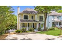 Charming two-story home with a welcoming front porch and well-manicured lawn at 2653 W Main Nw St, Atlanta, GA 30318