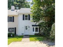 Charming two-story townhome with white siding, black shutters, and a well-maintained front yard at 289 Westland Sw Way, Marietta, GA 30064