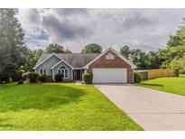 Charming single Gathering home featuring a brick facade, attached garage, and a well-manicured front lawn at 250 Meadow View Dr, Grayson, GA 30017