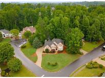Stunning two-story brick home with lush landscaping and mature trees in a desirable neighborhood at 2759 Thomashire Trce, Marietta, GA 30066