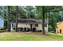 Charming single-story home with a well-maintained lawn and mature trees at 3646 Salem Dr, Lithonia, GA 30038