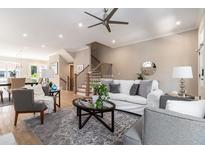 Bright living room featuring neutral colors, a ceiling fan, and hardwood floors at 671 Brennan Dr, Decatur, GA 30033