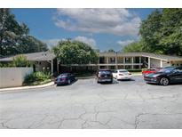 The parking lot showcases well-maintained landscaping and ample parking for residents and guests at 1150 Collier Rd # K3, Atlanta, GA 30318
