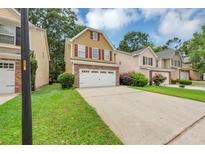 Charming two-story home with a two car garage and well-maintained lawn and an inviting curb appeal at 2165 Capella Cir, South Fulton, GA 30331