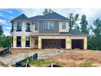 Two-story home under construction with a 2-car garage and a covered front entry at 4436 Hosch Reserve Ct, Buford, GA 30519