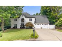 Charming two-story home with a manicured lawn and attached two-car garage at 5286 Wild Indigo Nw Way, Acworth, GA 30102