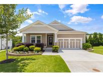 Charming single-story home featuring a manicured lawn, tidy landscaping, and a two-car garage with a neutral color scheme at 508 Windy Ridge Ct, Canton, GA 30114