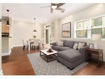 Inviting living room with hardwood floors, modern furnishings, and abundant natural light at 2230 Cheshire Bridge Ne Rd # 401, Atlanta, GA 30324