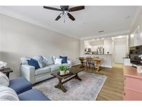 Inviting living room with open floorplan features stylish furniture and hardwood flooring at 1850 Cotillion Drive # 2118, Dunwoody, GA 30338