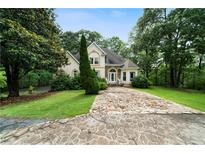 Charming home featuring stone accents, dormer windows, and a unique stone driveway at 790 Friendship Church Rd, Douglasville, GA 30134