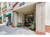 Inviting building entrance with planters and brick accents, showcasing the stylish facade at 230 E Ponce De Leon Ave # 324, Decatur, GA 30030