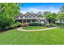 Inviting two-story home with a charming front porch and meticulously landscaped front yard at 3656 Ebenezer Rd, Marietta, GA 30066