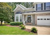 Charming two-story home featuring a manicured lawn, brick accents, and attached two-car garage in a suburban neighborhood at 4000 Mcpherson Drive Dr, Acworth, GA 30101