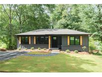 Charming single-story home with a gray exterior, freshly cut lawn, and a welcoming front entrance at 45 Driskell Ave, Mableton, GA 30126