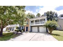 Charming two-story home featuring a balcony, a two-car garage, and well-maintained landscaping at 3157 Peartree Nw Dr, Acworth, GA 30101