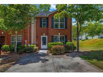 Charming brick townhouse featuring a well-maintained front yard and a cozy entrance at 3073 Waldrop Cir, Decatur, GA 30034