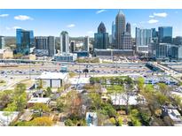 Stunning aerial view of the city skyline from a home located near major highways and urban amenities at 1231 Barnes Nw St, Atlanta, GA 30318