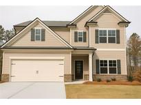 Charming two-story home with a two-car garage, neutral siding and dark shutters at 126 Jacobs Ln, Loganville, GA 30052