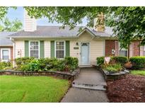 Charming one-story home featuring a well-manicured lawn, brick accents, and inviting curb appeal at 1926 Cheatham Woods Sw Dr, Marietta, GA 30008