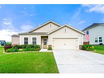 Charming single Gathering home with a well maintained lawn, two-car garage, and a beautifully landscaped garden at 3735 Westhaven Dr, Cumming, GA 30040
