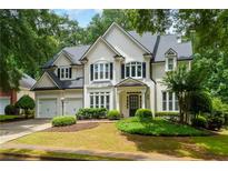 Charming traditional-style home with lush landscaping and a two-car garage at 2055 Beacon Hill Way, Alpharetta, GA 30005
