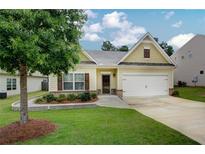 Charming one-story home with a well-manicured lawn and inviting curb appeal at 6470 Saint Mark Way, Fairburn, GA 30213