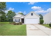 Charming single-Gathering home featuring a two-car garage, manicured lawn, and blossoming landscape at 7057 Silver Bend Ovrlk, Austell, GA 30168