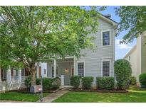 Charming two-story home featuring a welcoming front porch and beautifully landscaped front yard, great curb appeal at 747 Gardenside Se Cir, Marietta, GA 30067
